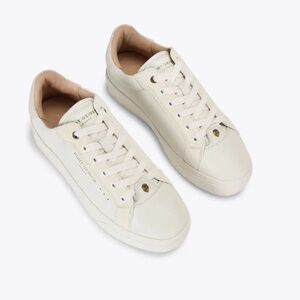 Kurt Geiger The Kensington Cupsole sneaker features a white leather